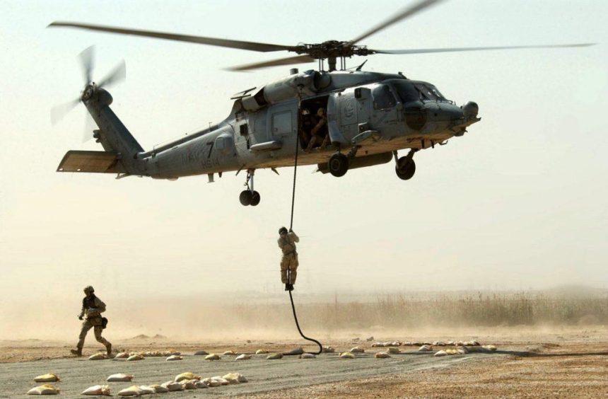 Operators fast roping from the 160th SOAR (A) helicopter