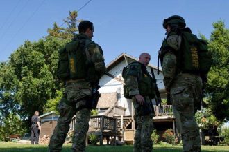 Sacramento Sheriff's Department Special Enforcement Detail (SED) operators executing the high-risk search warrant