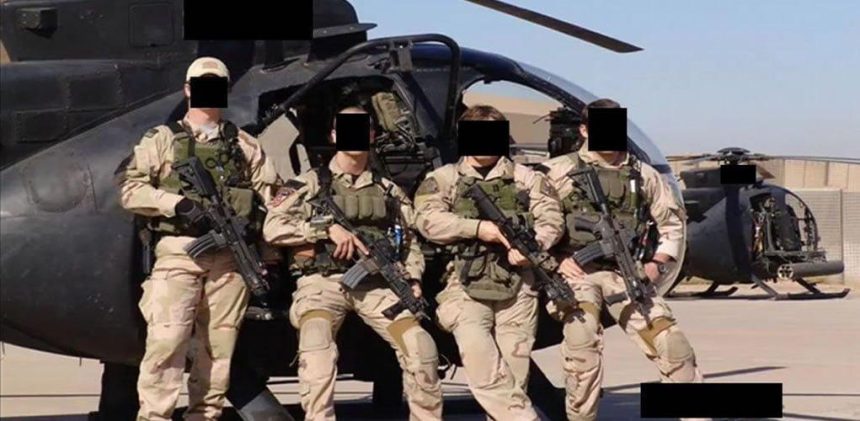 Special Operations Forces from JSOC at undisclosed location posing in front of helicopter