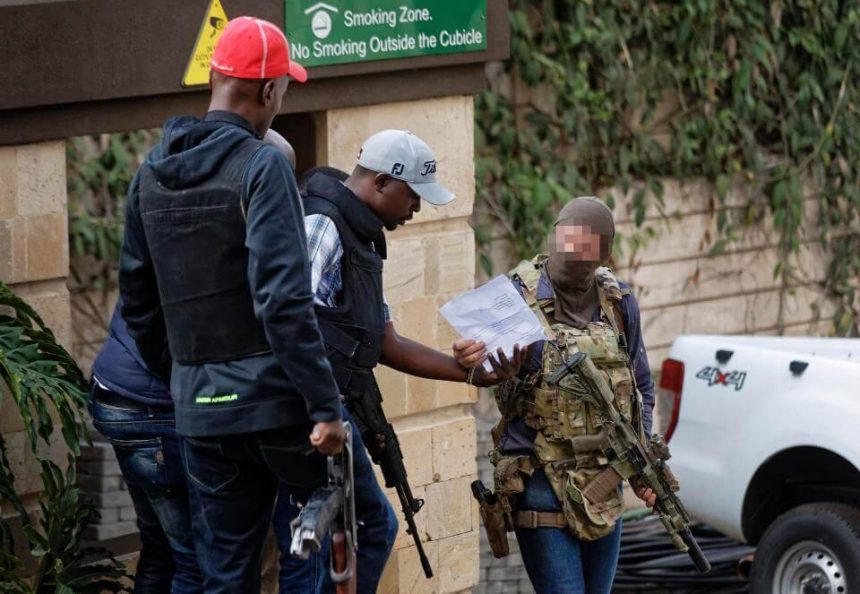 SAS operator is seen speaking with another armed rescuer during hostage crisis in Kenya