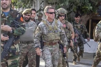 General Austin Miller brandishing Glock pistol at his hip