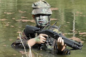 A New Zealand Army soldier armed with a Benelli M3 Super 90