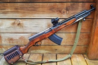 SKS rifle with 30 round magazine and installed optical sight