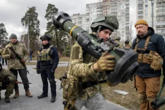 A Ukrainian Territorial Defence Forces member holds an NLAW anti-tank weapon, in the outskirts of Kyiv, Ukraine, on March 9, 2022
