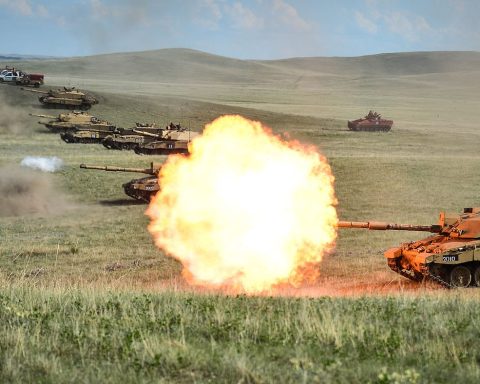 Row of Challenger 2 on a firing range at BATUS, Canada