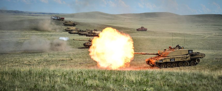 Row of Challenger 2 on a firing range at BATUS, Canada