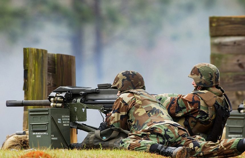 US Navy sailors fire a Mk 19 40 mm grenade launcher during a training exercise in March 2003