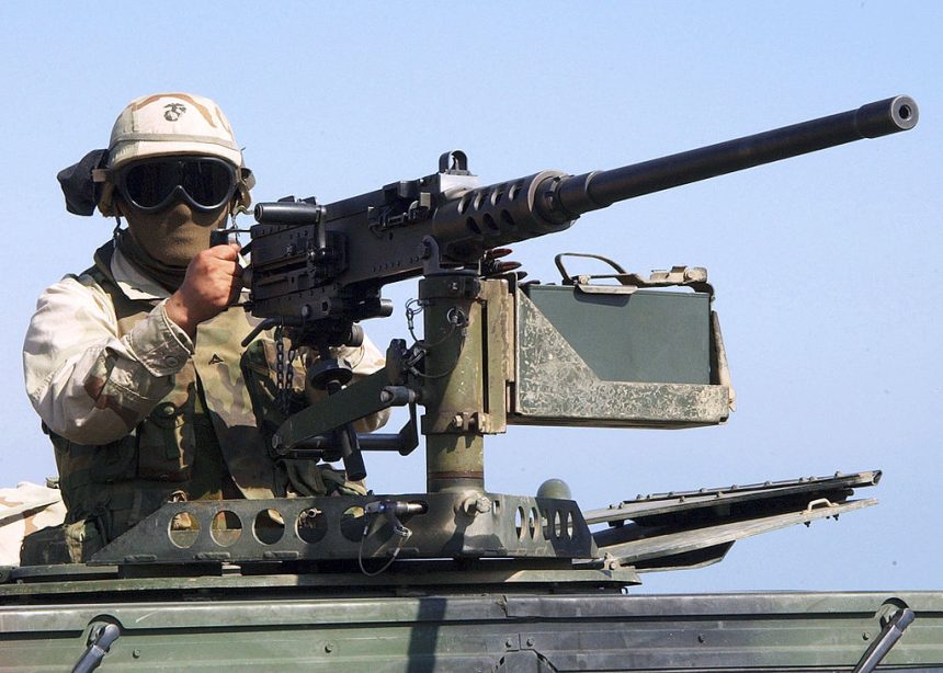 A marine prepares to fire from M2 Browning machine gun