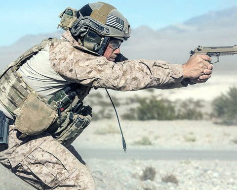 US soldier aiming with his Beretta M9A3