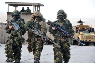 British snipers with L115A3 Long Range Rifle with suppressor