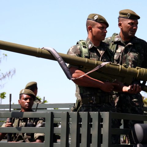 Three French Foreign Legion soldiers posing with a 9K38 Igla (SA-18 Grouse) MANPADS launcher during field operations