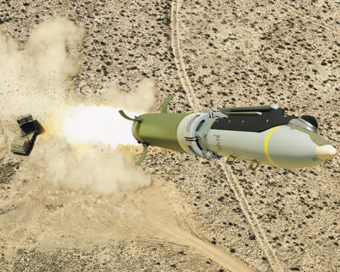GLSDB cruise missile in mid-flight with its ground-based artillery launch system visible in the background, demonstrating modern precision strike technology that minimizes collateral damage