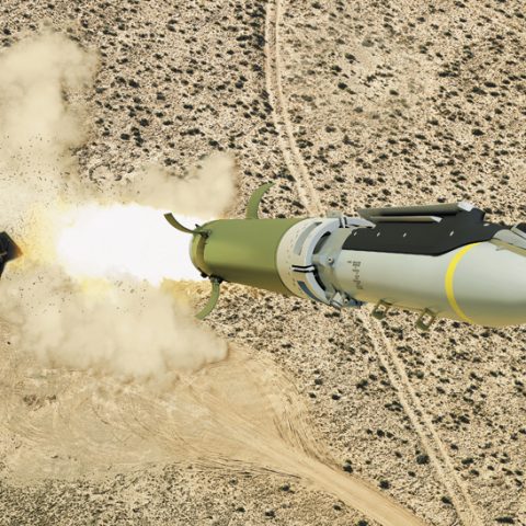 GLSDB cruise missile in mid-flight with its ground-based artillery launch system visible in the background, demonstrating modern precision strike technology that minimizes collateral damage