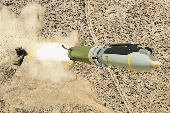 GLSDB cruise missile in mid-flight with its ground-based artillery launch system visible in the background, demonstrating modern precision strike technology that minimizes collateral damage