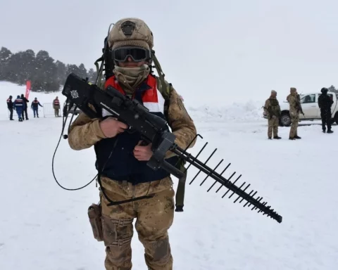 Turkish soldier carrying IHASAVAR anti-drone jamming backpack system during a security operation.