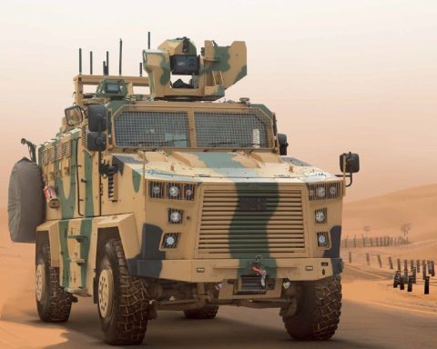 Turkish Kirpi II MRAP armored vehicle driving across desert terrain during military exercises.