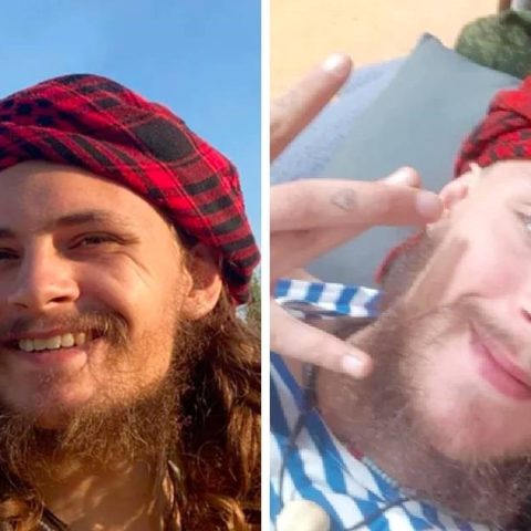Michael Alexander Gloss smiling with a beard, before joining the Russian military