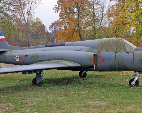 Soko J-21 Jastreb in front of hangar covered with protective equipment