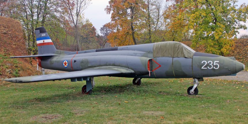 Soko J-21 Jastreb in front of hangar covered with protective equipment