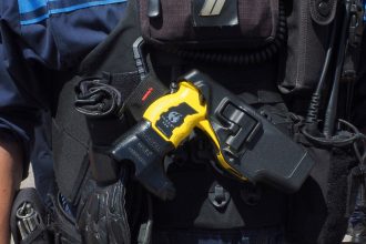 Taser x26 on police officers belt