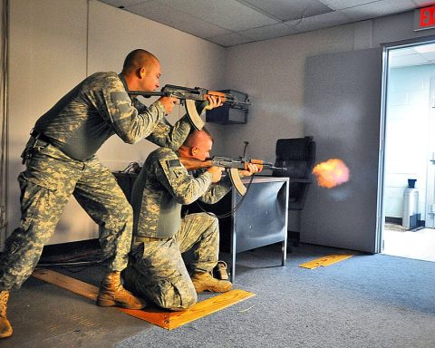 Two US soldiers firing Zastava M70 and AKM rifle during training